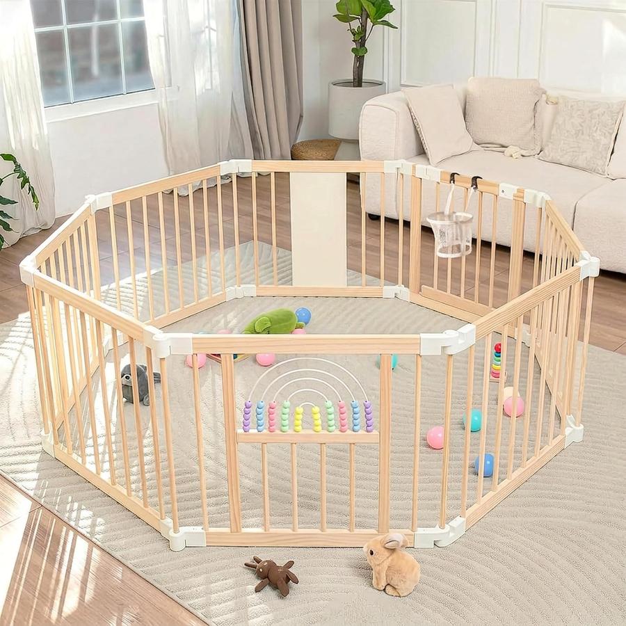 Smooth pine top rail of the Ulnxiy wooden playpen with even wood grain visible
